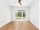 Bright bedroom with hardwood floors, a ceiling fan, and large windows at 1621 Bruce Circle, Raleigh, NC 27604