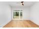 Bright bedroom with hardwood floors, a ceiling fan, and large windows at 1621 Bruce Circle, Raleigh, NC 27604