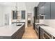 Spacious kitchen with a large island, modern appliances, and sleek gray cabinetry at 1621 Bruce Circle, Raleigh, NC 27604