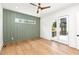 A bedroom with natural light and a door leading to the backyard at 1625 Bruce Circle, Raleigh, NC 27604