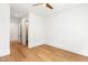 Bright bedroom with hardwood floors, ceiling fan, and ensuite bathroom at 1625 Bruce Circle, Raleigh, NC 27604