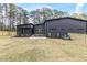 Modern home exterior showcases a well-maintained backyard at 1625 Bruce Circle, Raleigh, NC 27604