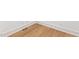 A close up of hardwood flooring with white baseboards at 1625 Bruce Circle, Raleigh, NC 27604