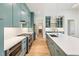 A modern kitchen with an island, stainless steel appliances, and blue cabinetry at 1625 Bruce Circle, Raleigh, NC 27604