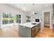 A bright kitchen with an island and stainless steel appliances at 1625 Bruce Circle, Raleigh, NC 27604