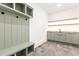 Mud room with storage cubbies and a utility sink at 1625 Bruce Circle, Raleigh, NC 27604
