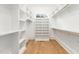 A walk-in closet with shelves and wood flooring at 1625 Bruce Circle, Raleigh, NC 27604
