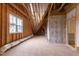 Unfinished attic showing construction materials and potential for build-out at 1629 Montvale Grant Way, Cary, NC 27519