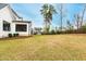 Wide backyard with a lush green lawn and a fence, providing ample space for recreation at 1629 Montvale Grant Way, Cary, NC 27519