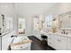 Serene bathroom with a soaking tub, shower, and vanity with modern fixtures at 1629 Montvale Grant Way, Cary, NC 27519