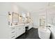 Elegant bathroom with double vanities, soaking tub, and sleek finishes at 1629 Montvale Grant Way, Cary, NC 27519