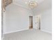 Bright bedroom with neutral carpet and paint and a modern light fixture at 1629 Montvale Grant Way, Cary, NC 27519