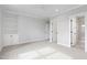Spacious bedroom featuring a ceiling fan, built-in shelving, and an attached bathroom with tiled shower at 1629 Montvale Grant Way, Cary, NC 27519