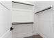 Walk-in closet with black hardware and ample shelving provides storage at 1629 Montvale Grant Way, Cary, NC 27519