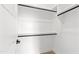Walk-in closet with black hardware and shelving awaiting organization at 1629 Montvale Grant Way, Cary, NC 27519