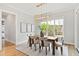 Dining area with natural light, a modern chandelier, and neutral decor at 1629 Montvale Grant Way, Cary, NC 27519