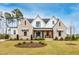 Charming brick and siding home with a well-manicured lawn and stylish architectural details at 1629 Montvale Grant Way, Cary, NC 27519