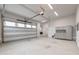Spacious garage with a large door and epoxy flooring, offering ample storage and parking space at 1629 Montvale Grant Way, Cary, NC 27519
