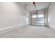 Clean and empty garage with a smooth concrete floor, ready for customization and storage at 1629 Montvale Grant Way, Cary, NC 27519