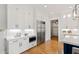 Well-lit kitchen with stainless steel appliances, white cabinets, and modern design for a sleek and functional cooking space at 1629 Montvale Grant Way, Cary, NC 27519