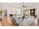 Open-concept living room with hardwood floors, coffered ceiling, and seamless access to the kitchen and outdoor patio at 1629 Montvale Grant Way, Cary, NC 27519