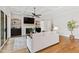 Cozy living room with a fireplace, custom built-ins, hardwood floors, and a comfortable seating arrangement at 1629 Montvale Grant Way, Cary, NC 27519