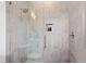 Modern walk-in shower featuring glass door, showerhead, and tiled walls at 1629 Montvale Grant Way, Cary, NC 27519