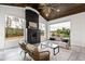 Bright sunroom with a cozy seating arrangement and a modern fireplace feature at 1629 Montvale Grant Way, Cary, NC 27519