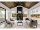 Bright sunroom with wooden ceiling, a cozy fireplace and multiple windows with backyard views at 1629 Montvale Grant Way, Cary, NC 27519