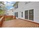 Spacious wooden deck attached to the home with an entry door, perfect for outdoor gatherings at 1903 Yellowwood Ln, Durham, NC 27712