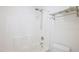 Clean white bathroom with a shower/tub combo and neutral shower curtain at 1903 Yellowwood Ln, Durham, NC 27712