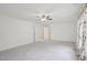 Spacious bedroom with ceiling fan and view to adjacent hall at 1903 Yellowwood Ln, Durham, NC 27712