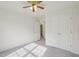 Bedroom featuring ceiling fan, double closet, and lots of sunlight at 1903 Yellowwood Ln, Durham, NC 27712