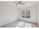 Bedroom with ceiling fan and large windows providing natural light at 1903 Yellowwood Ln, Durham, NC 27712
