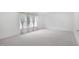 Large bedroom with curtains and carpet flooring at 1903 Yellowwood Ln, Durham, NC 27712