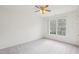 Bedroom with carpeting, ceiling fan, and double window for natural lighting at 1903 Yellowwood Ln, Durham, NC 27712