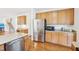 Updated kitchen with stainless appliances, ample cabinet space, and adjacent dining area for convenient entertaining at 1903 Yellowwood Ln, Durham, NC 27712