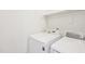 Bright laundry room features modern Samsung washer and dryer, and shelf at 1903 Yellowwood Ln, Durham, NC 27712