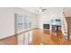 Comfortable living room with hardwood floors, cozy fireplace, and large windows providing great natural light at 1903 Yellowwood Ln, Durham, NC 27712