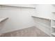 Ample closet space with wood rods and shelves for optimal storage at 1903 Yellowwood Ln, Durham, NC 27712
