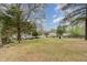 Expansive backyard with a mix of grass and foliage, offering a serene outdoor space at 201 E End Ave, Durham, NC 27703
