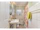 A clean, classic bathroom featuring a shower with tiled walls, classic tile floor, and essential fixtures at 201 E End Ave, Durham, NC 27703