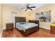 Comfortable bedroom with hardwood floors, windows offering natural light, and standard furnishings at 201 E End Ave, Durham, NC 27703