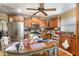 A fully-equipped kitchen with stainless steel appliances and ample counter space, with hardwood floors and wooden cabinets at 201 E End Ave, Durham, NC 27703