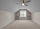 Bedroom featuring neutral walls, carpet, a window, and built-in shelving at 203 Grassy Point Rd, Apex, NC 27502