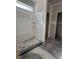 Bathroom featuring a shower stall, unfinished walls, and a small window at 21 Mildred Pl, Broadway, NC 27505