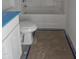 Bathroom with a toilet, tub with shower, and a small vanity in a compact space at 21 Mildred Pl, Broadway, NC 27505