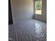 This bedroom showcases a window view to the outside and neutral colored walls at 21 Mildred Pl, Broadway, NC 27505