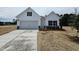 Charming new construction home with a manicured lawn and a freshly paved driveway at 21 Mildred Pl, Broadway, NC 27505