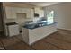 New kitchen with a kitchen island, white cabinetry, and modern sink at 21 Mildred Pl, Broadway, NC 27505